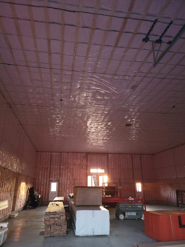 Warehouse and commercial insulation in Ottawa. Fibreglass batts and poly